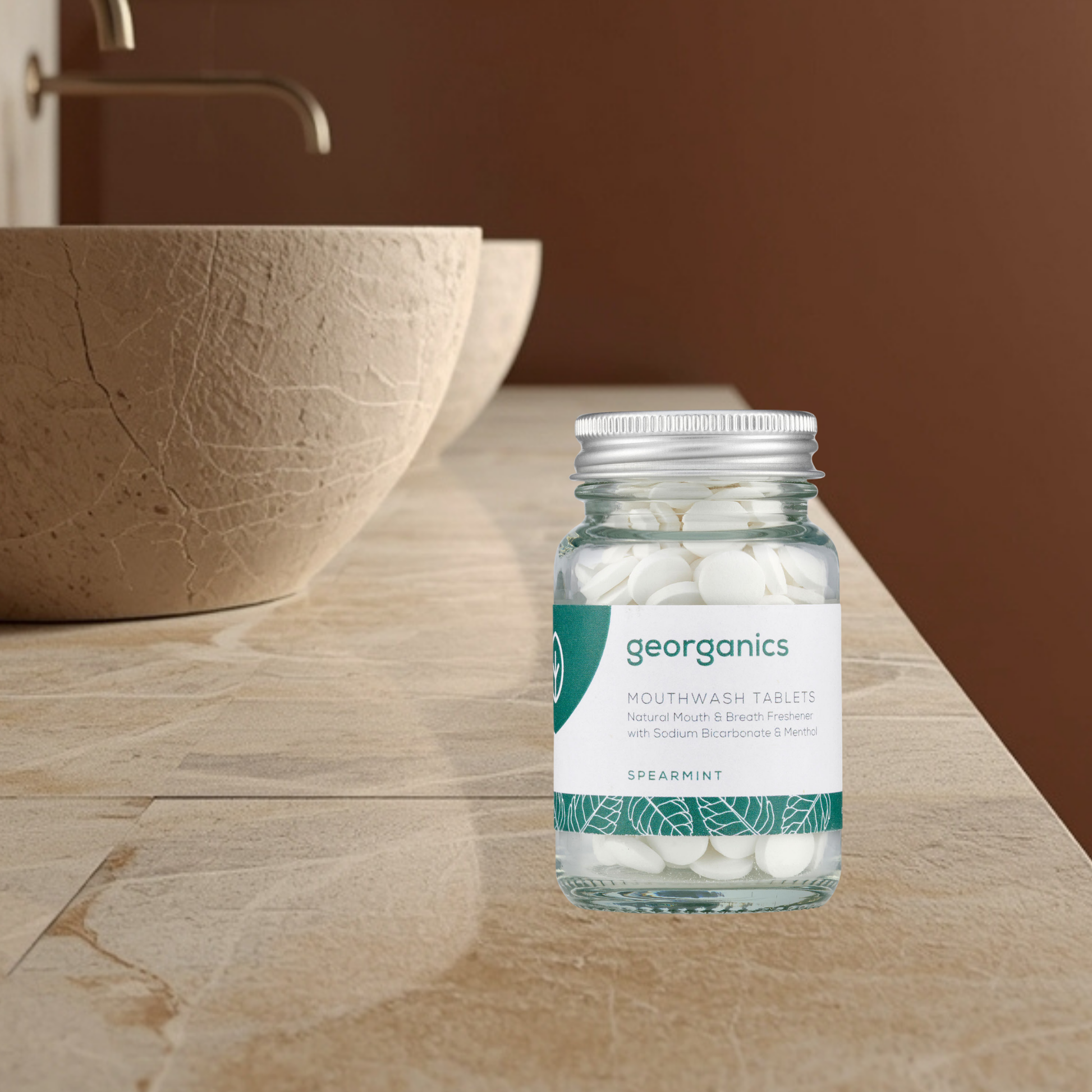 Bottle of georganics spearmint mouthwash tablets on a bathroom counter