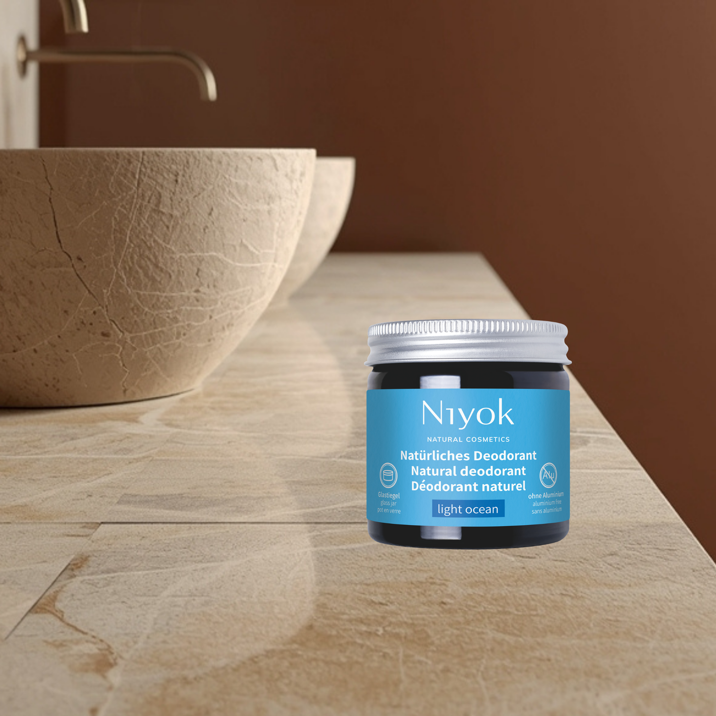 Niyok natural deodorant jar light ocean on a bathroom counter