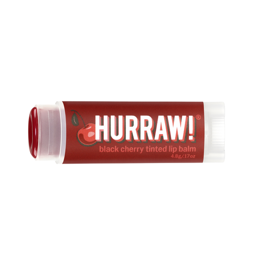 Hurraw! black cherry tinted lip balm on a white background