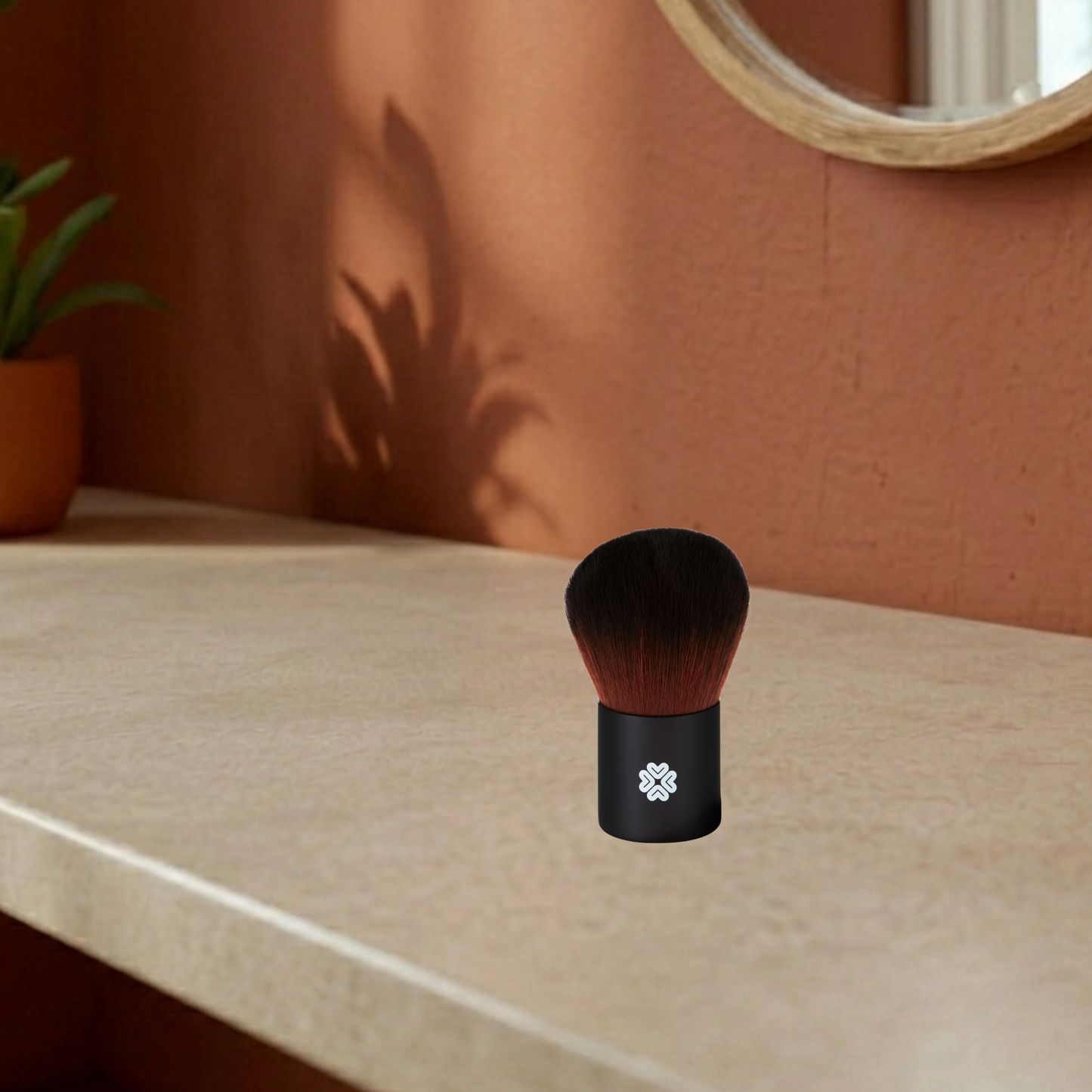 Black super kabuki makeup brush with brown bristles on a mediterranean background