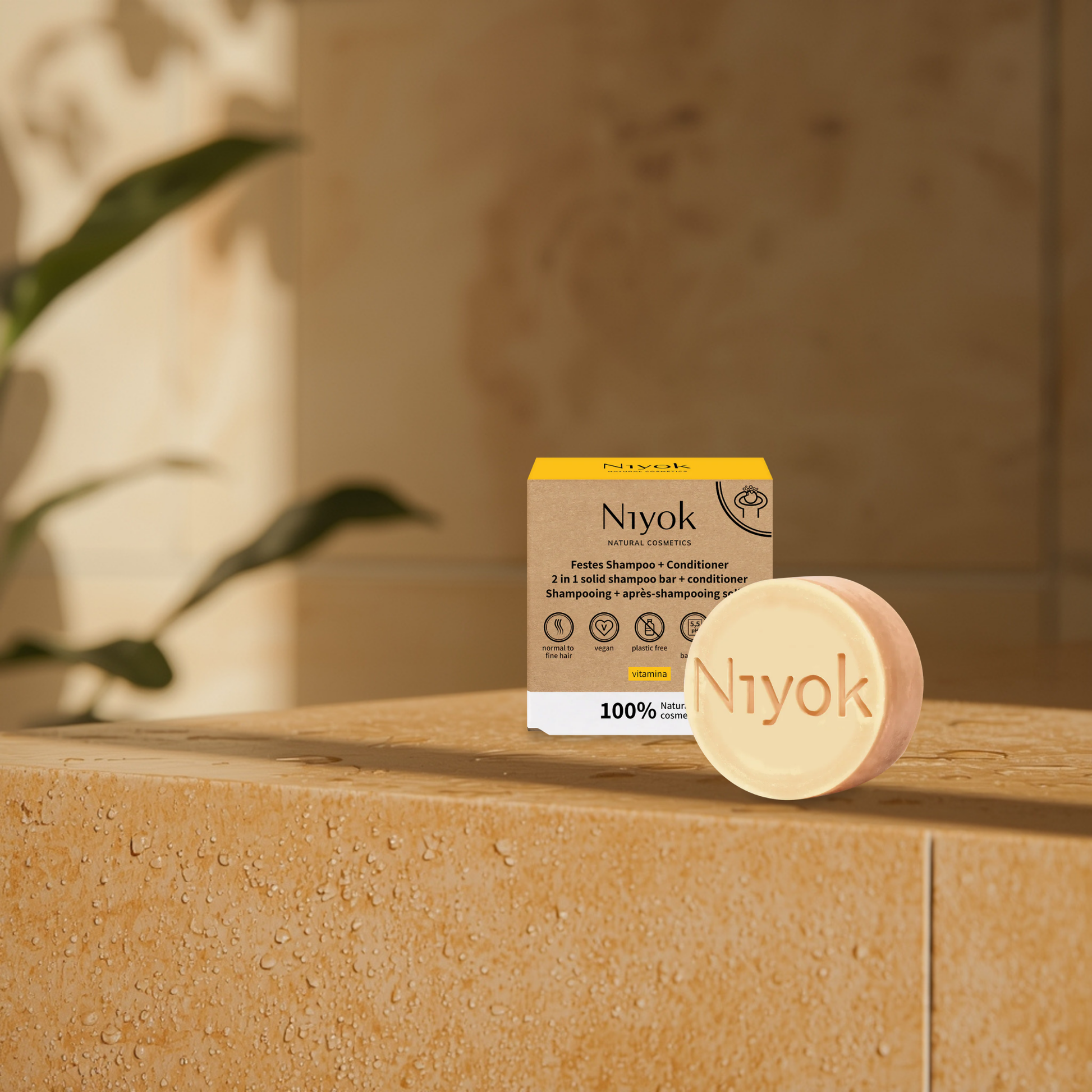 Niyok vitamina citrus shampoo and conditioner bar and packaging on a stone surface with a blurred background