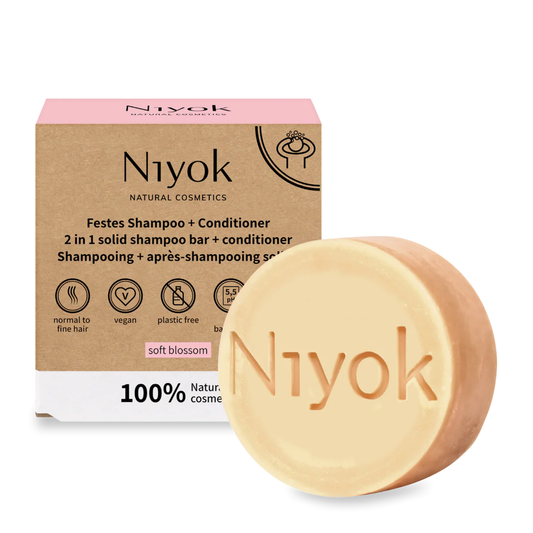 Niyok soft blossom natural shampoo and conditioner bar with packaging on a white background