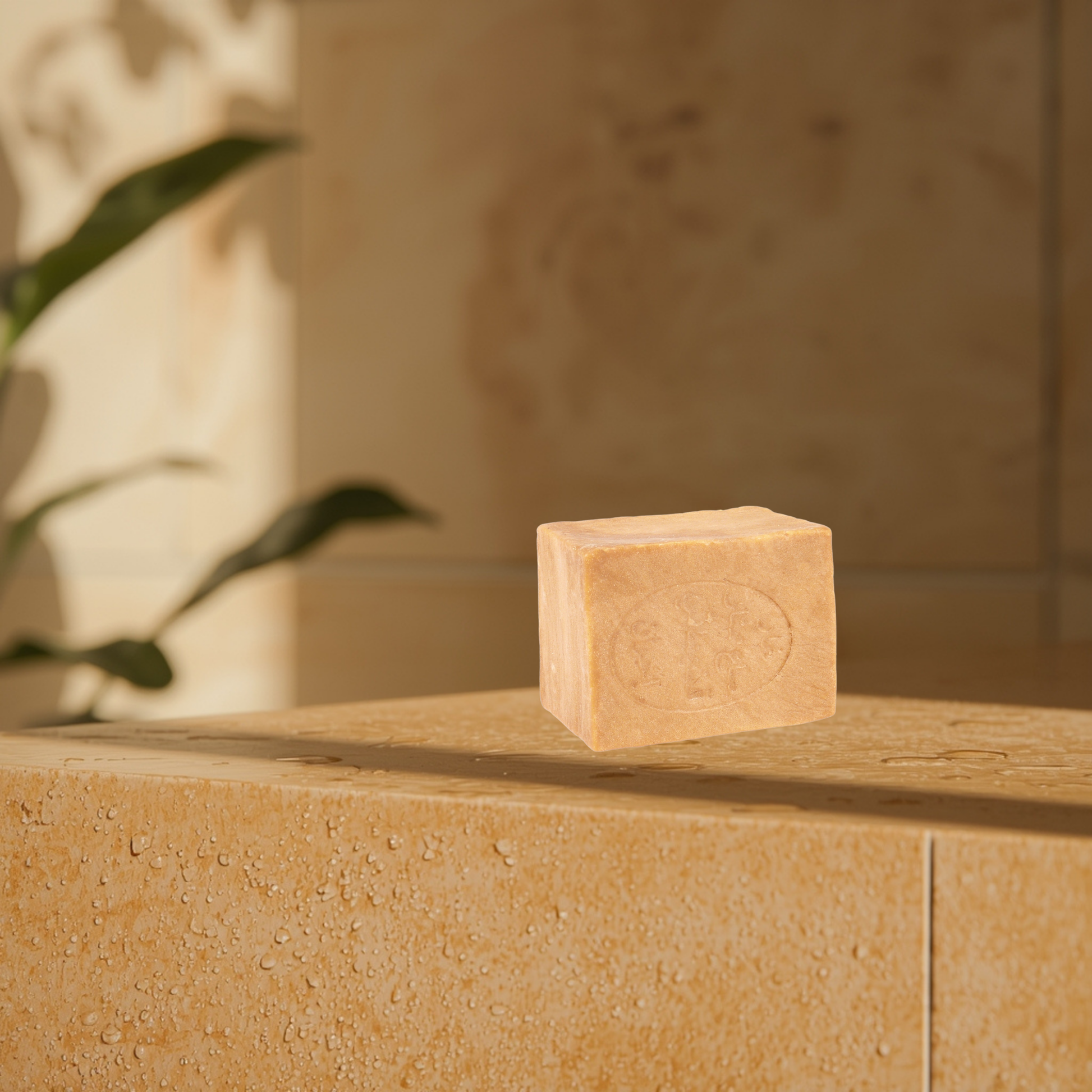 Aleppo 6% bar soap on a stone surface with a blurred background