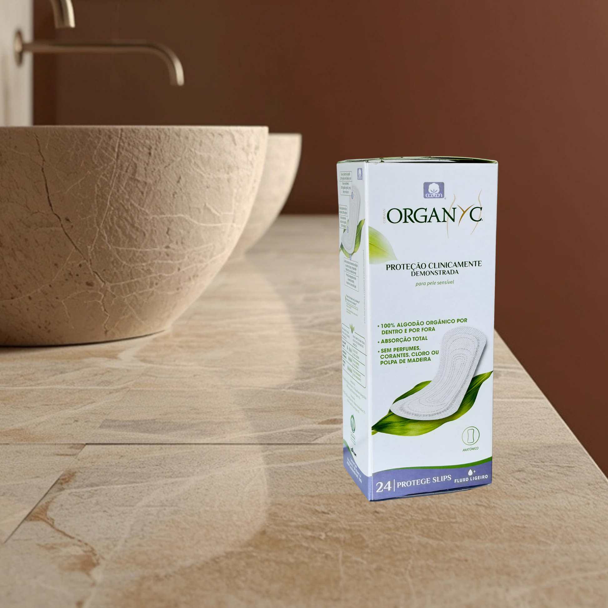 ORGANYC panty liners on a bathroom counter with a sink in the background