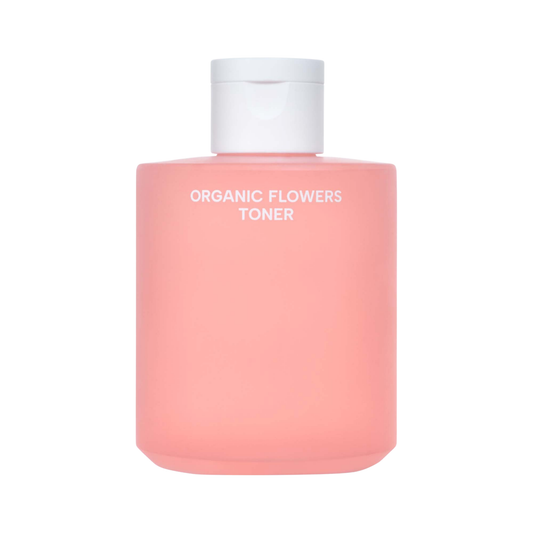 Pink bottle of Whamisa Organic Flowers Toner with a white cap on a white background
