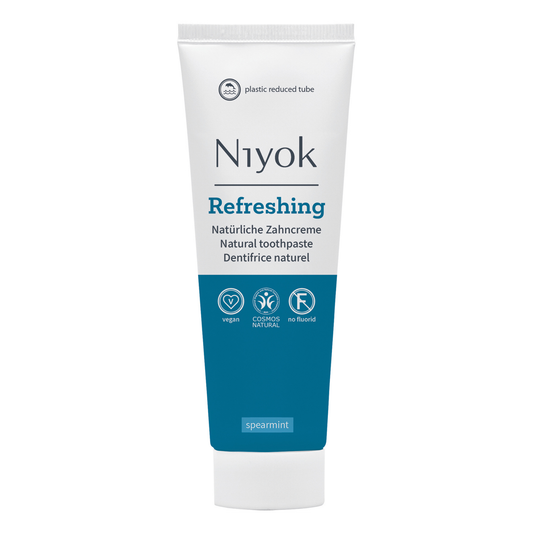 Niyok refreshing natural toothpaste tube on a white background