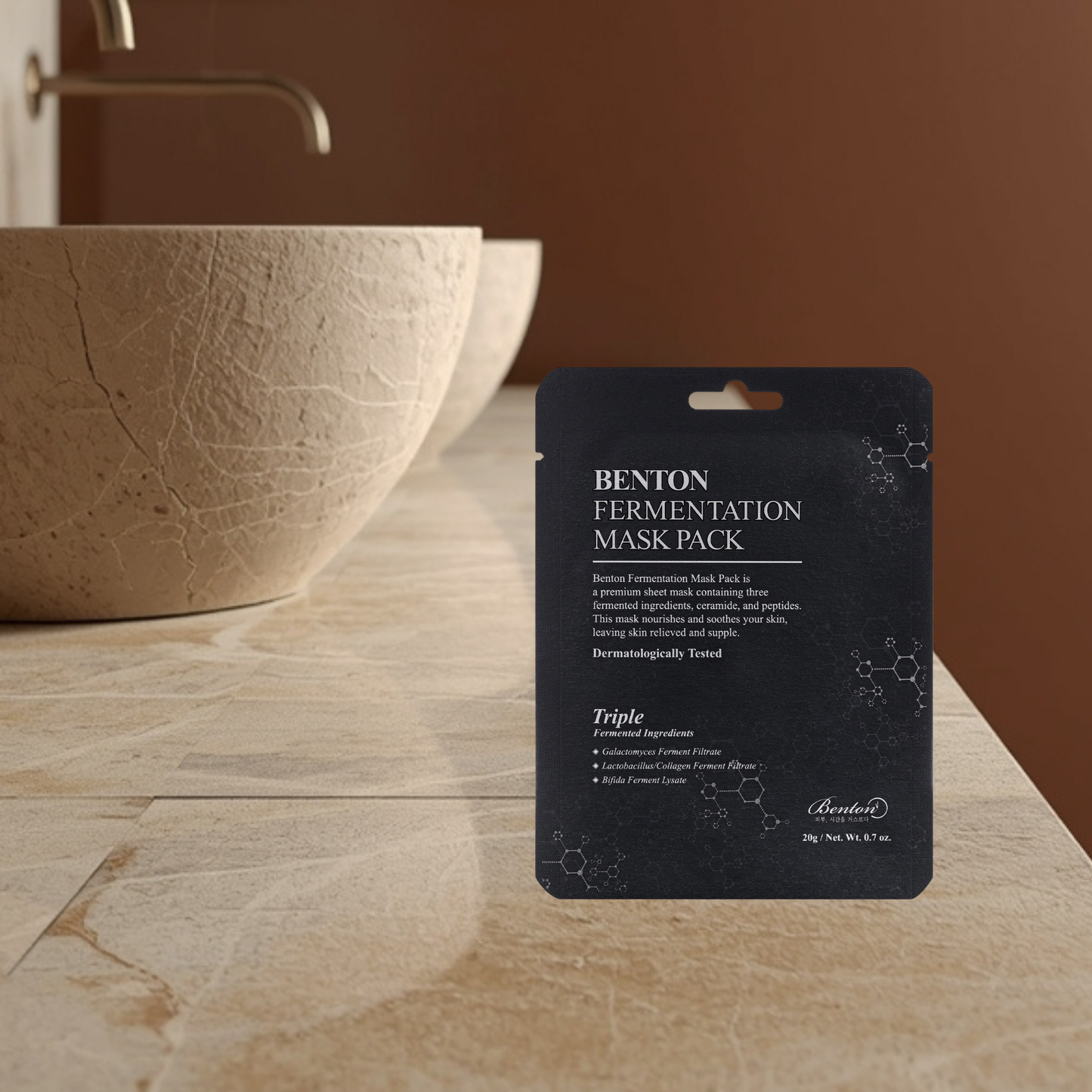 Benton fermentation mask pack on a bathroom counter with a sink in the background