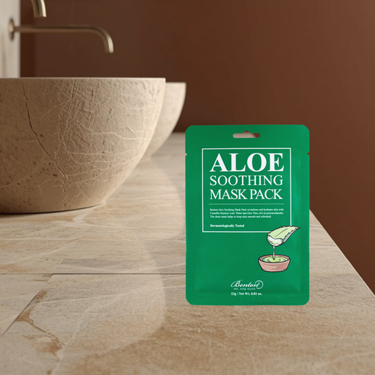 Benton Aloe soothing mask pack on a bathroom counter with a sink in the background