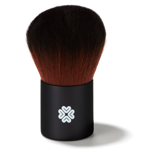 Black super kabuki makeup brush with brown bristles on a white background