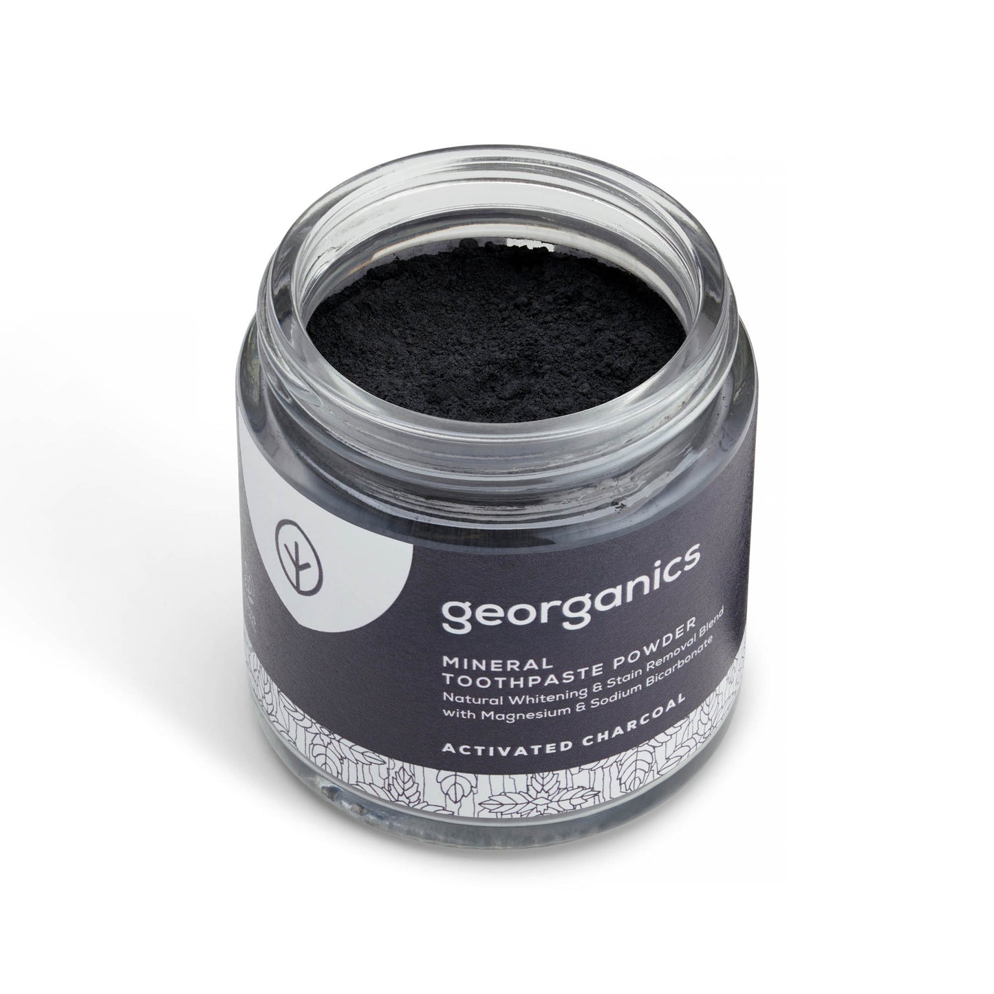 Jar of georganics activated charcoal mineral toothpaste powder with black powder inside on a white background
